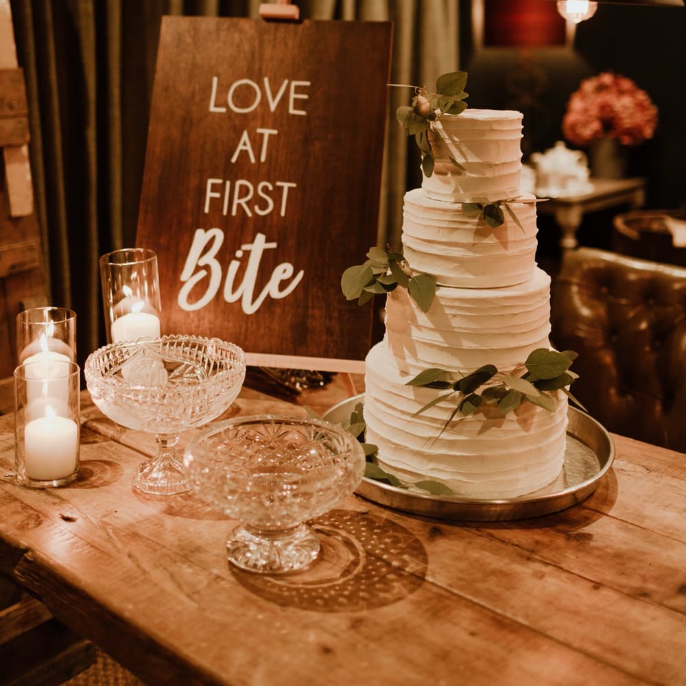 Buttercream Wedding Cake With Foliage Image By The Curries