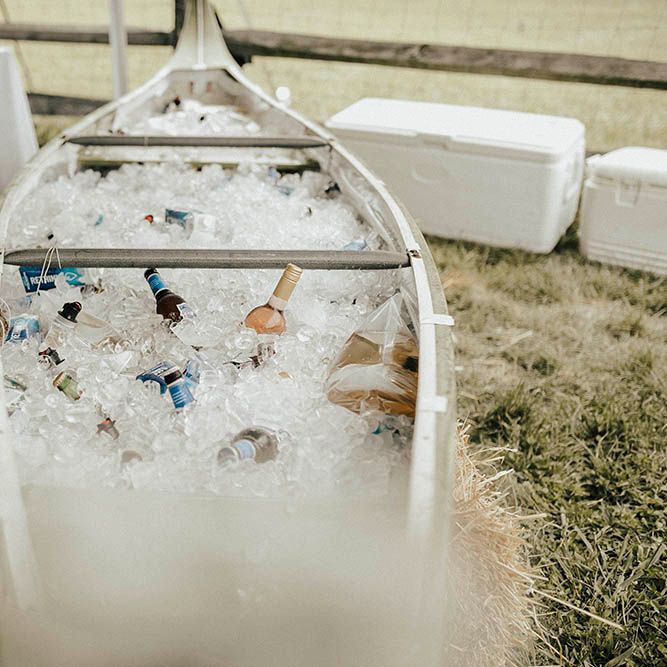 Canoe Filled With Beer For Wedding | Jenny Yoo Bride For An Outdoor Farm Wedding In Maryland USA With Bridesmaids In Mismatched Dresses & Images From Erin Krespan