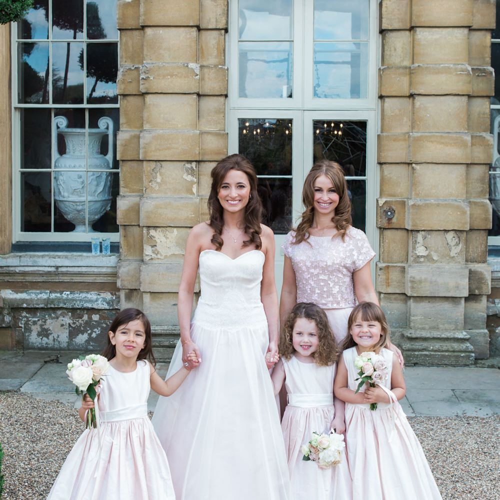 Flower Girls in Nicki MacFarlane Outfits | Bride in Sarah Bussey from Ivory & Co. Gown | Bridesmaid in Pink Coast Sequin Top & High Low Skirt Separates | Elegant Blush Pink & White Wedding at Aynhoe Park in Oxfordshire | Lucy Davenport Photography