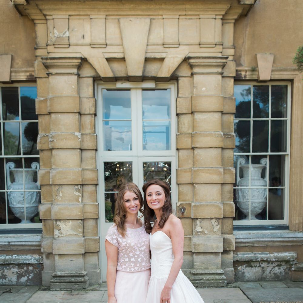 Bride in Sarah Bussey from Ivory & Co. Gown | Bridesmaid in Pink Coast Sequin Top & High Low Skirt Separates | Elegant Blush Pink & White Wedding at Aynhoe Park in Oxfordshire | Lucy Davenport Photography