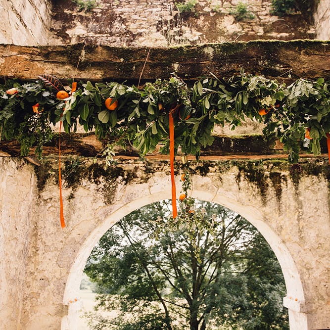 Greenery & Orange Wedding Floral Arrangement