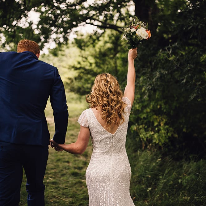 Bride in Eliza Jane Howell Gown & Groom in Navy Paul Smith Suit