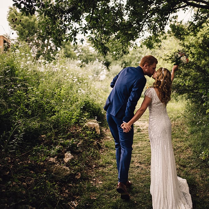 Bride in Eliza Jane Howell Gown & Groom in Navy Paul Smith Suit