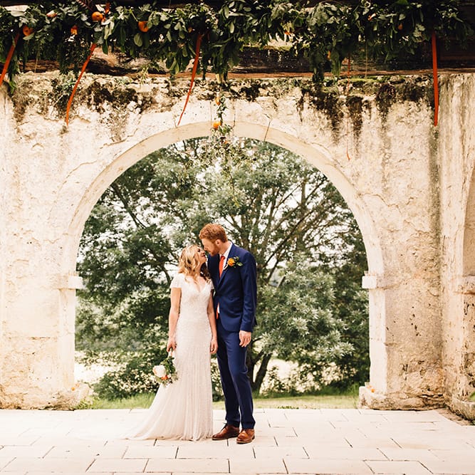 Bride in Eliza Jane Howell Gown & Groom in Navy Paul Smith Suit