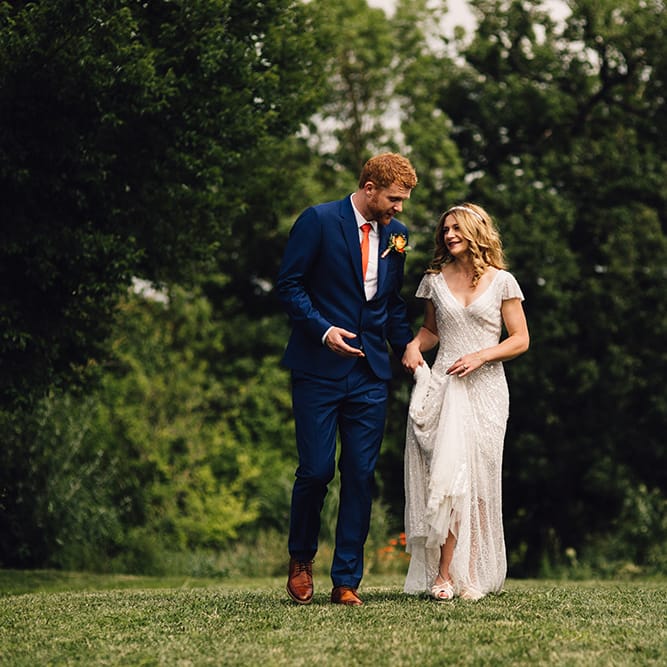 Bride in Eliza Jane Howell Gown & Groom in Navy Paul Smith Suit