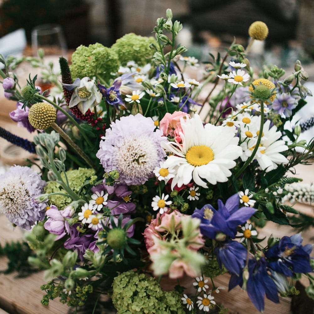 Rime Arodaky Bride For A Rustic Wild Flower Filled Wedding at Anran Devon With Mismatched Bridesmaids Dresses & Images From A Thing Like That Photography