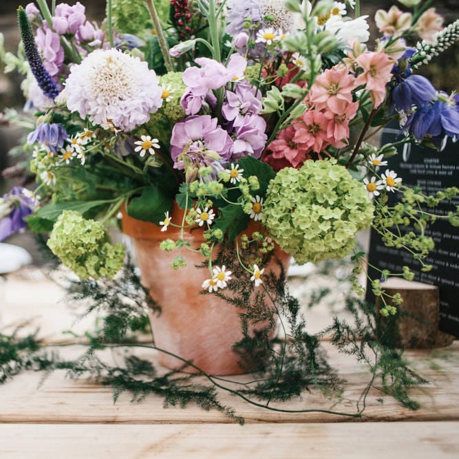 Rime Arodaky Bride For A Rustic Wild Flower Filled Wedding at Anran Devon With Mismatched Bridesmaids Dresses & Images From A Thing Like That Photography