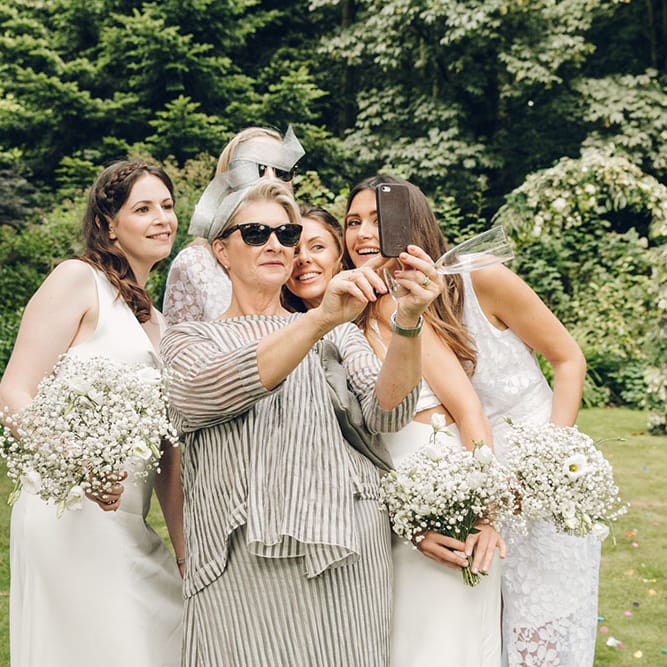 Bride & Bridesmaids in White Dresses by Harriet Holling
