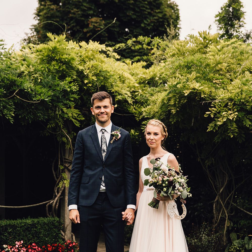 Bride in Catherine Deane Tamsin Wedding Dress & Groom in Paul Smith Suit