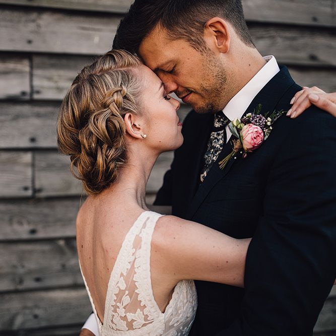 Bride in Catherine Deane Tamsin Wedding Dress & Groom in Paul Smith Suit
