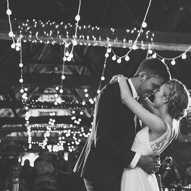Bride in Catherine Deane Tamsin Wedding Dress & Groom in Paul Smith Suit