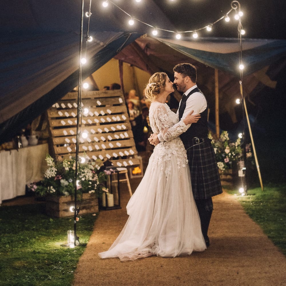 Festoon Lights For A Tipi Wedding // Rainy Tipi Wedding At The Coach House at Kinross House Scotland With Bride In Embellished Bespoke Dress And Images From Photos By Zoe