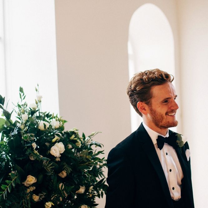 Groom waiting at the Altar