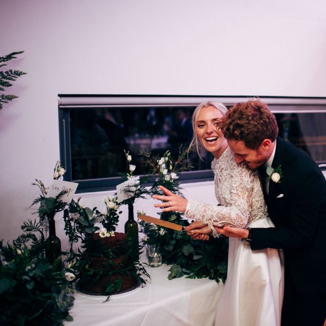 Bride & Groom Cutting The Cake