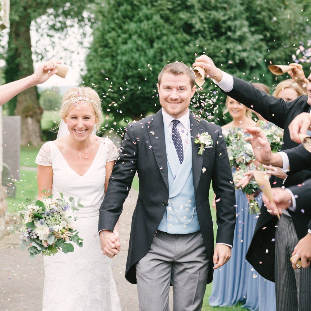 Confetti Moment with Bride in Charlie Brear Peyton Dress & Augustine Skirt & Groom in Traditional Tails