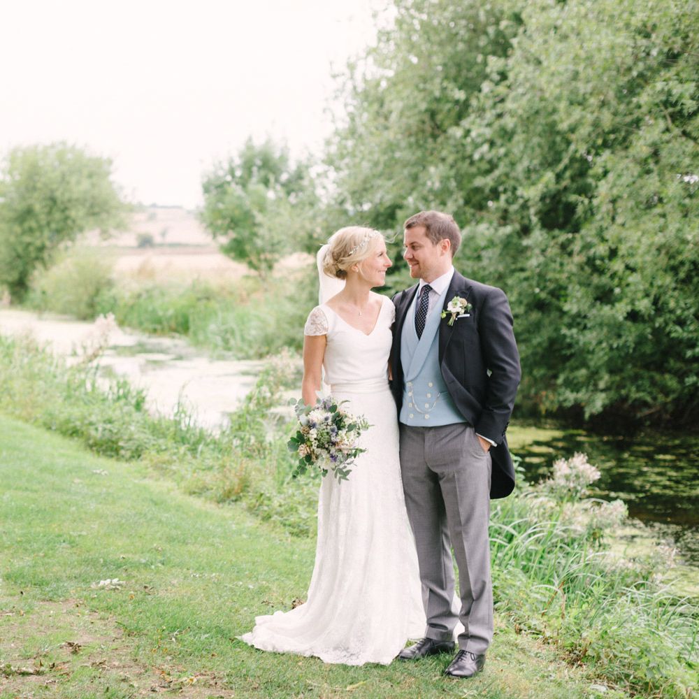 Bride in Charlie Brear Peyton Dress & Augustine Skirt & Groom in Traditional Morning Suit