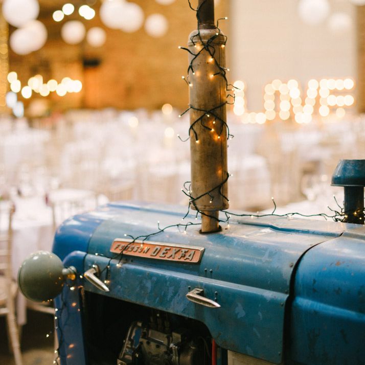 Tractor in Lantern Filled Rustic Barn Reception
