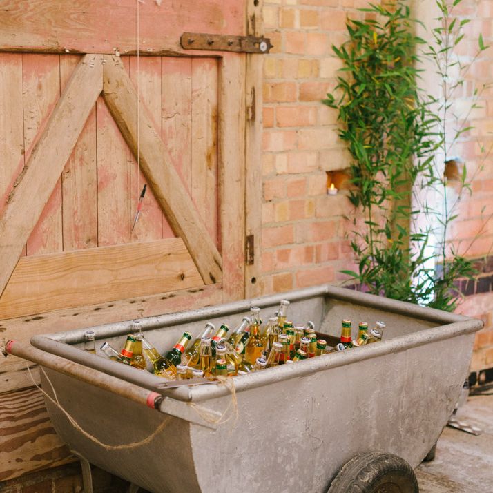 Metal Wheel Barrow Filled with Beer Bottles