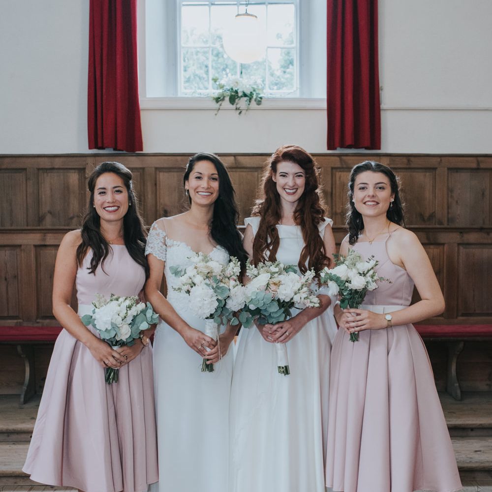Two Brides in Lou Lou Bridal Wedding Dress & White Leaf Bridal Wedding Dress | Bridesmaids in Blush Pink Chi Chi London Adele Dress
