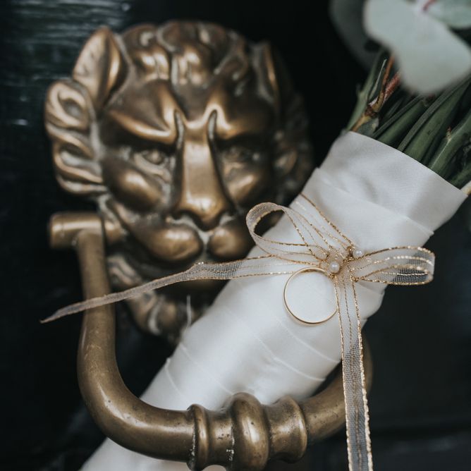 Gold Ribbon Wrapped Around the Bridal Bouquet