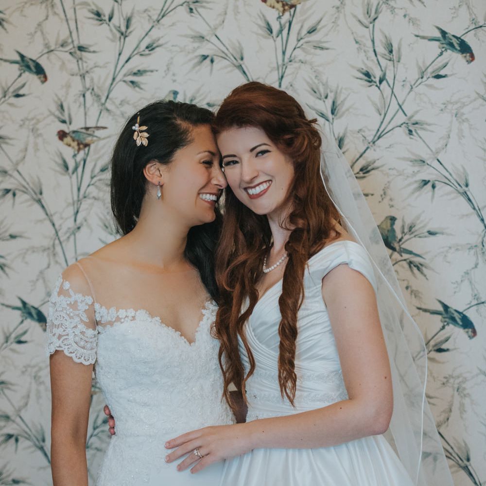 Two Brides in Ocean Bridal Studio Wedding Dress & White Leaf Bridal Wedding Dress