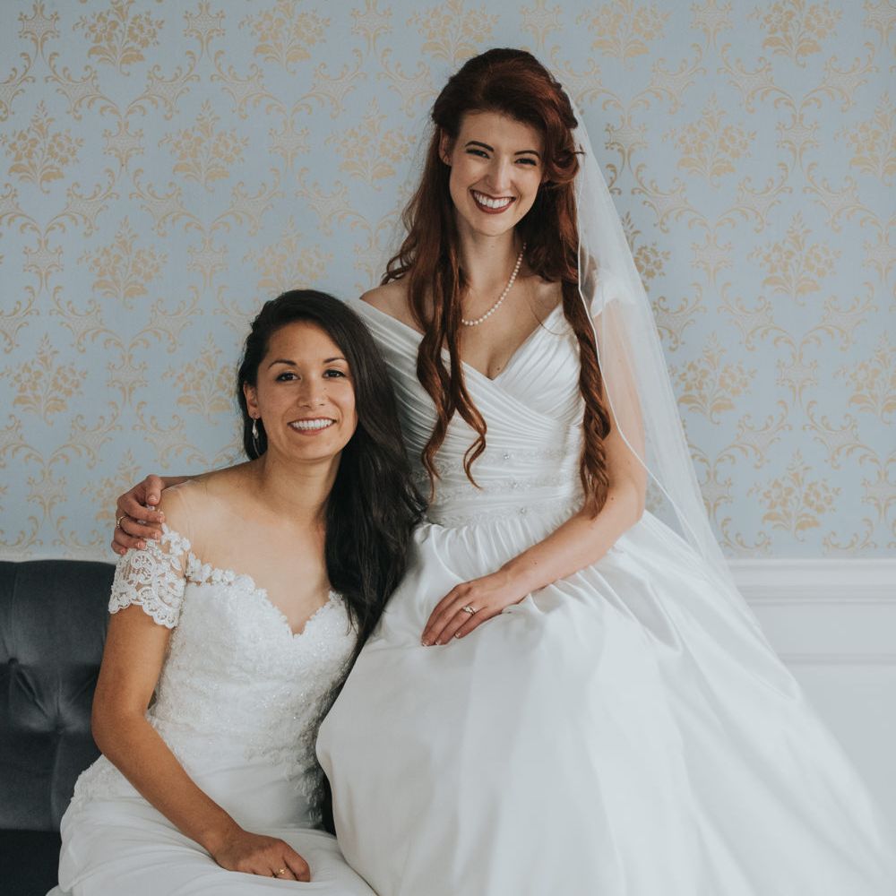 Two Brides in Ocean Bridal Studio Wedding Dress & White Leaf Bridal Wedding Dress