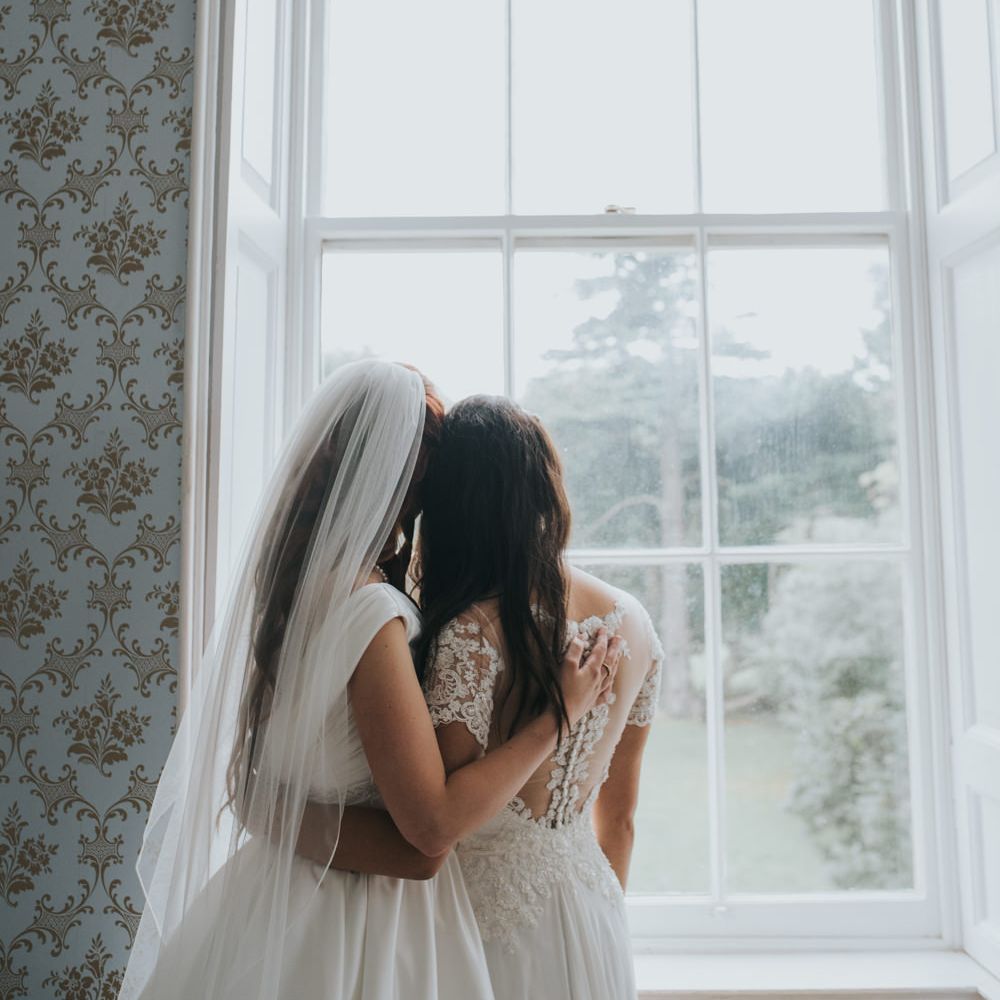 Two Brides in Ocean Bridal Studio Wedding Dress & White Leaf Bridal Wedding Dress