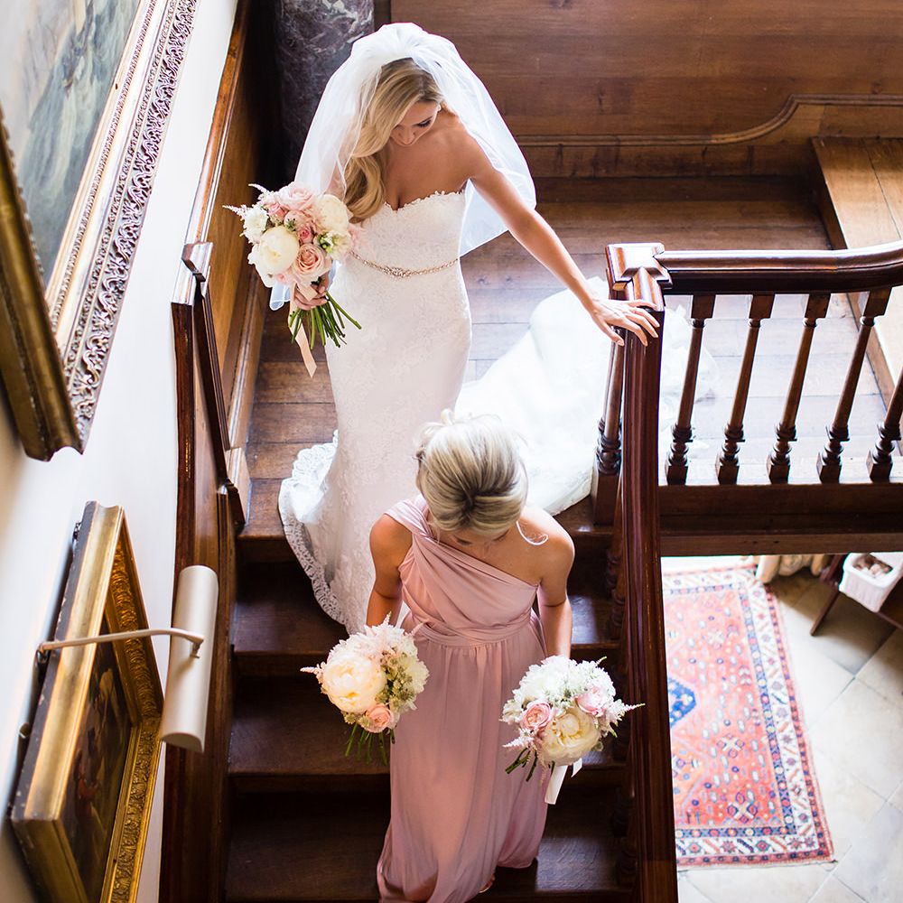 Elegant Bride in Pronovias Wedding Dress & Bridesmaids in Pink Multiway Dresses
