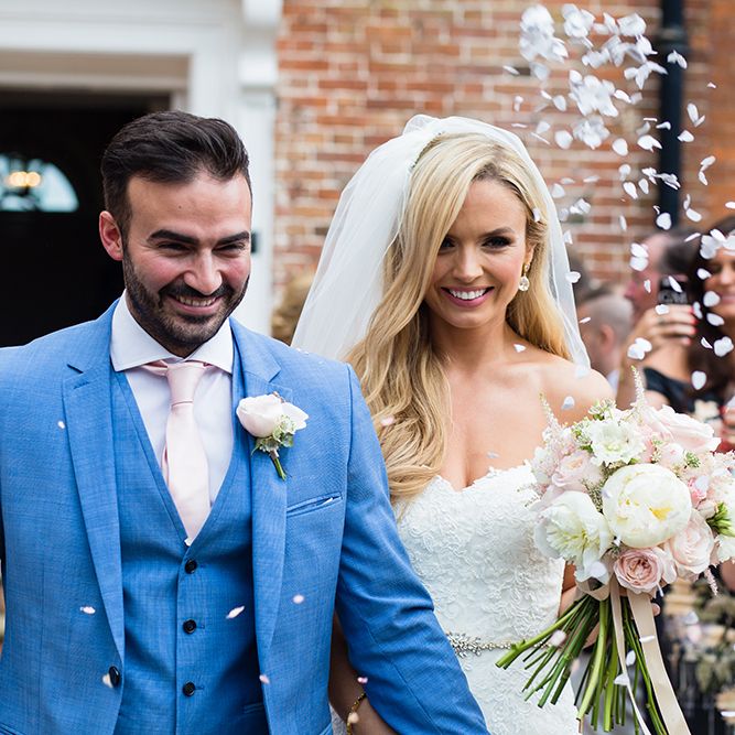 Bride in Pronovias Wedding Dress & Groom in Blue Hugo Boss Suit
