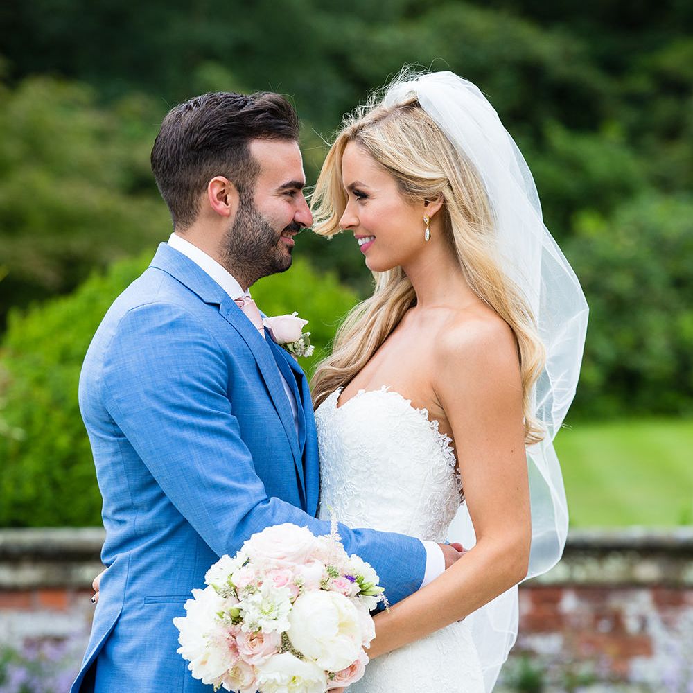 Bride in Pronovias Wedding Dress & Groom in Blue Hugo Boss Suit