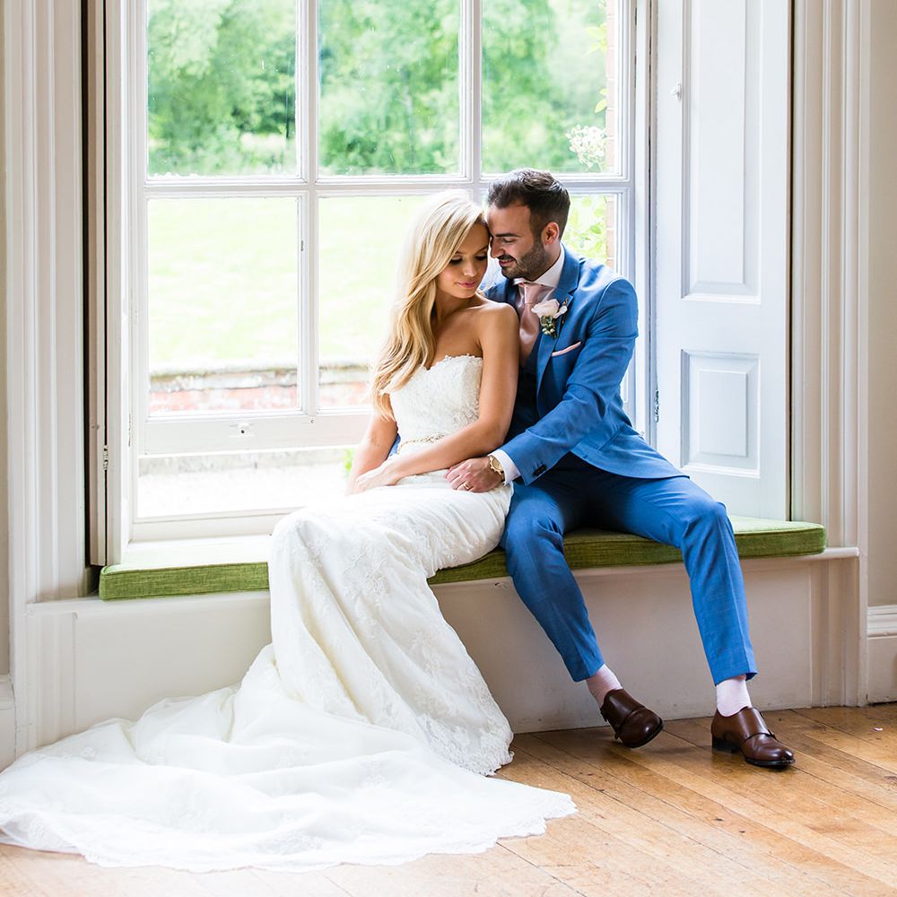 Bride in Pronovias Wedding Dress & Groom in Blue Hugo Boss Suit