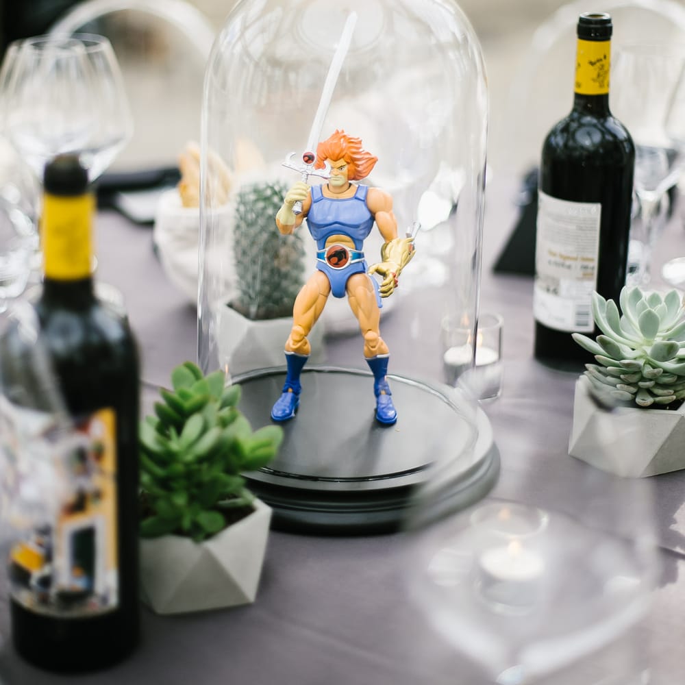 Iconic 80s Figure (Lion o Thundercat) in Bell Jar Table Centrepiece Wedding Decor | Monochrome Wedding at Syon Park London | Chris Barber Photography | Second Shooter Beatrici Photography