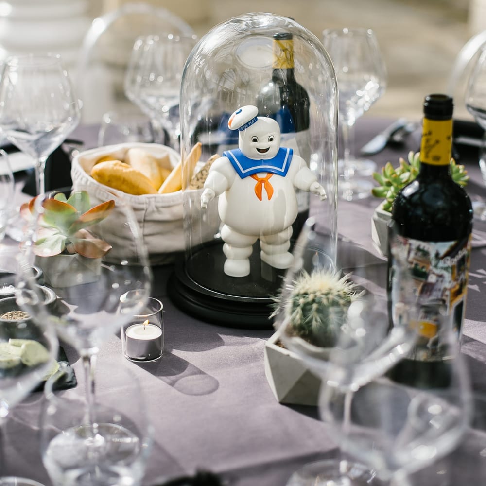 Iconic 80s Figure (Marshmallow Man - Ghostbusters) in Bell Jar Table Centrepiece Wedding Decor | Monochrome Wedding at Syon Park London | Chris Barber Photography | Second Shooter Beatrici Photography