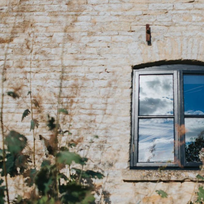 A Cotswold rustic wedding with mismatched bridesmaid dresses