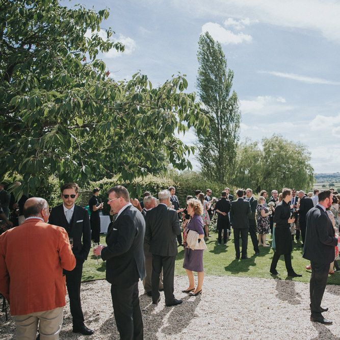 A Cotswold rustic wedding with mismatched bridesmaid dresses