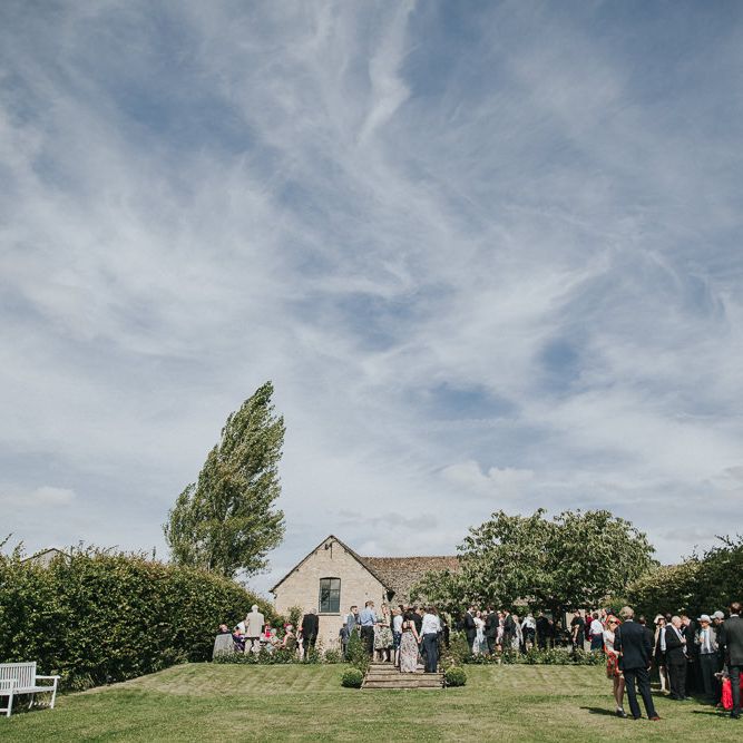 A Cotswold rustic wedding with mismatched bridesmaid dresses