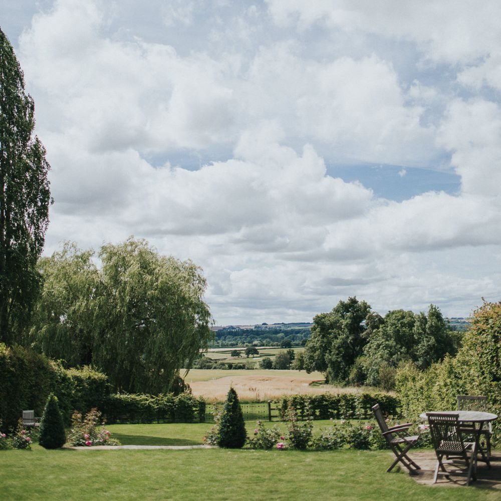 A Cotswold rustic wedding with mismatched bridesmaid dresses