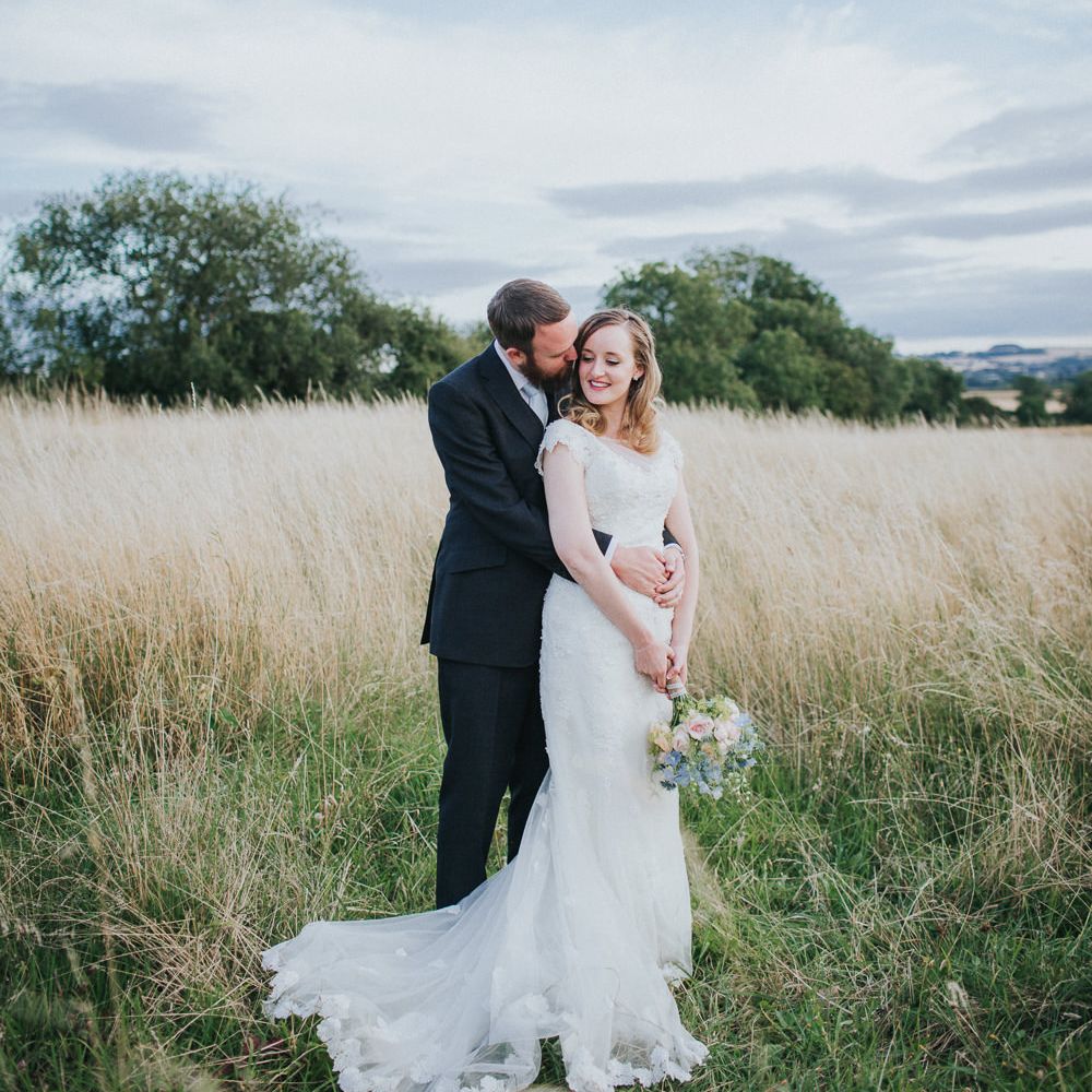 A Cotswold rustic wedding with mismatched bridesmaid dresses