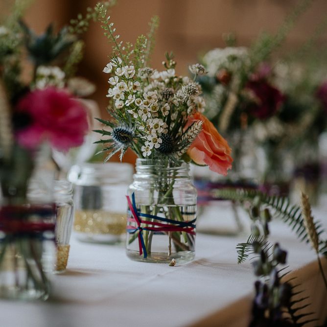 Jam Jar Flowers At Wedding