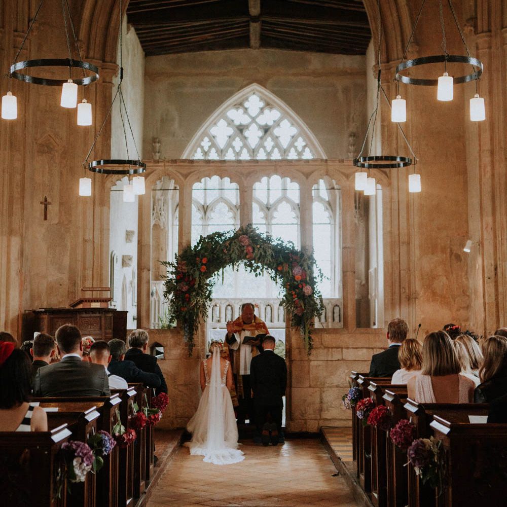Church Wedding Ceremony | Bride in Lace & Tulle Gown | Groom in Black Suit & Liberty Print Bow Tie | Colourful DIY Barn Wedding at The Manor Barn, Cambridge | Meghan Lorna Photography