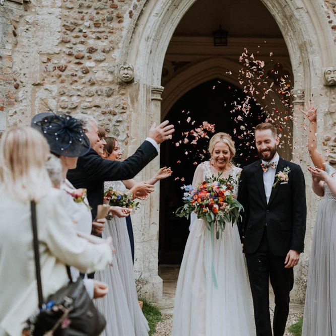 Church Wedding Ceremony | Bride in Lace & Tulle Gown | Groom in Black Suit & Liberty Print Bow Tie | Colourful DIY Barn Wedding at The Manor Barn, Cambridge | Meghan Lorna Photography