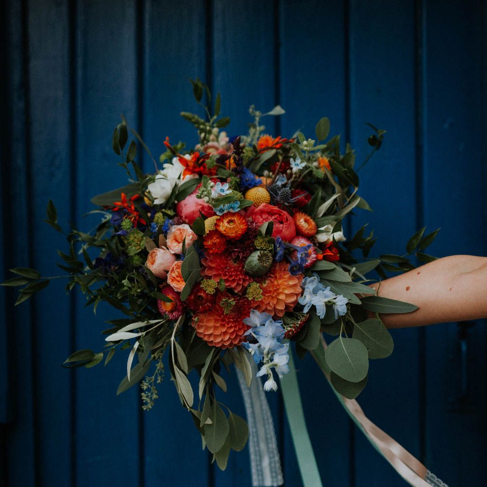 Red & Orange Wedding Bouqet with Dahlias & Ribbons | Colourful DIY Barn Wedding at The Manor Barn, Cambridge | Meghan Lorna Photography