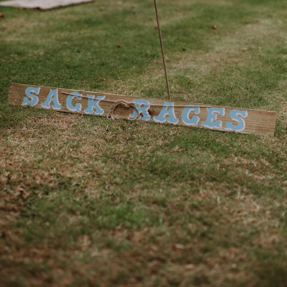 Sack Race Garden Games | Colourful DIY Barn Wedding at The Manor Barn, Cambridge | Meghan Lorna Photography