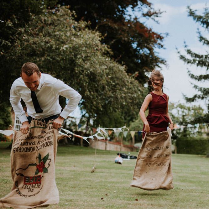 Sack Race Garden Games | Colourful DIY Barn Wedding at The Manor Barn, Cambridge | Meghan Lorna Photography