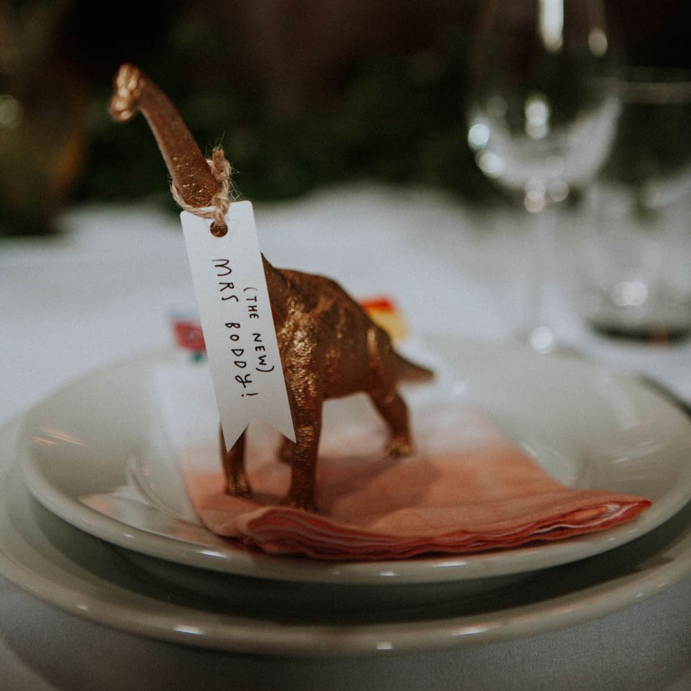 Spray Painted Dinosaur Place Setting | Colourful DIY Barn Wedding at The Manor Barn, Cambridge | Meghan Lorna Photography