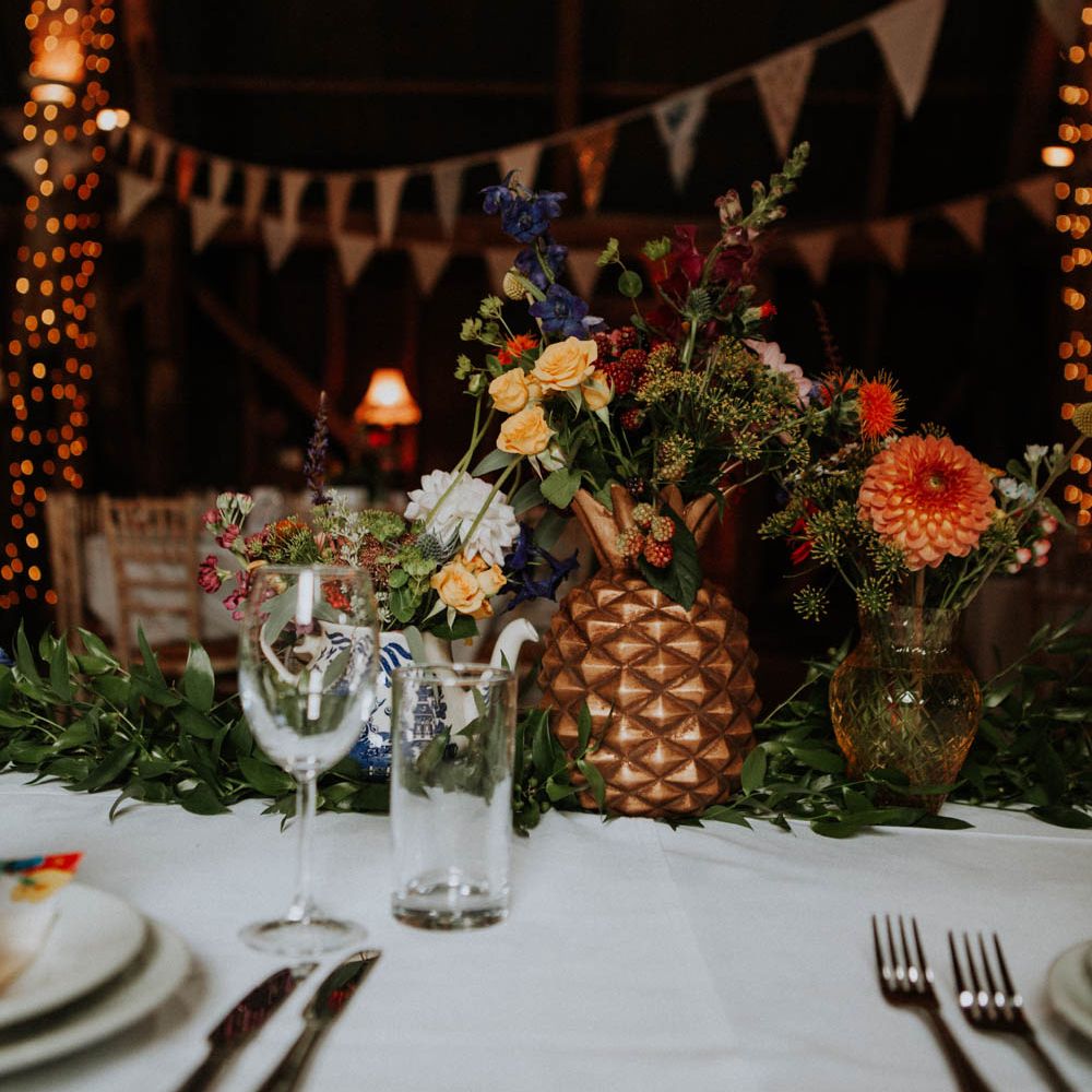 Flower Stems in Spray Painted Pineapple Centrepiece | Colourful DIY Barn Wedding at The Manor Barn, Cambridge | Meghan Lorna Photography