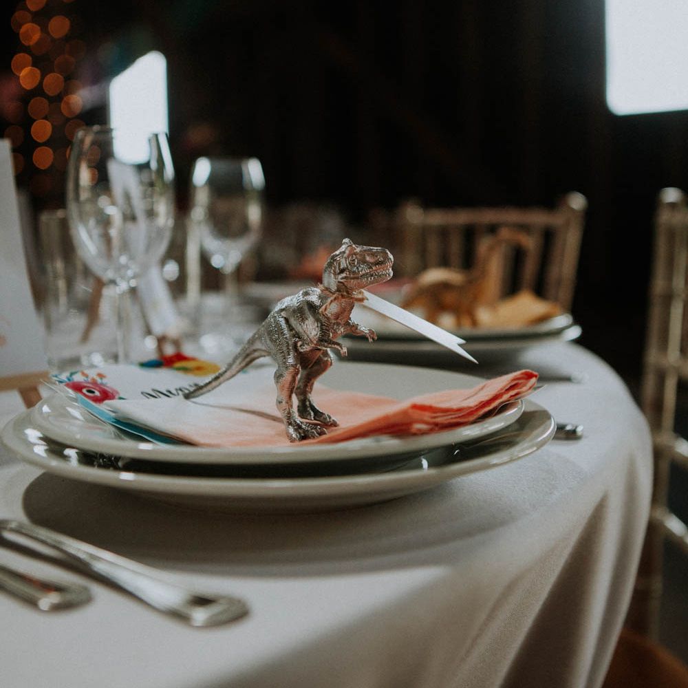 Spray Painted Dinosaur Place Setting | Colourful DIY Barn Wedding at The Manor Barn, Cambridge | Meghan Lorna Photography