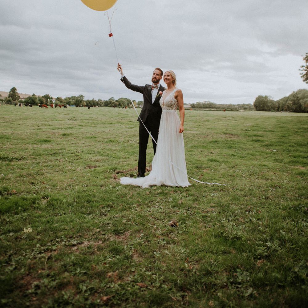 Giant Balloons | Bride in Illusion Lace & Tulle Wedding Dress | Groom in Bow Tie | Colourful DIY Barn Wedding at The Manor Barn, Cambridge | Meghan Lorna Photography