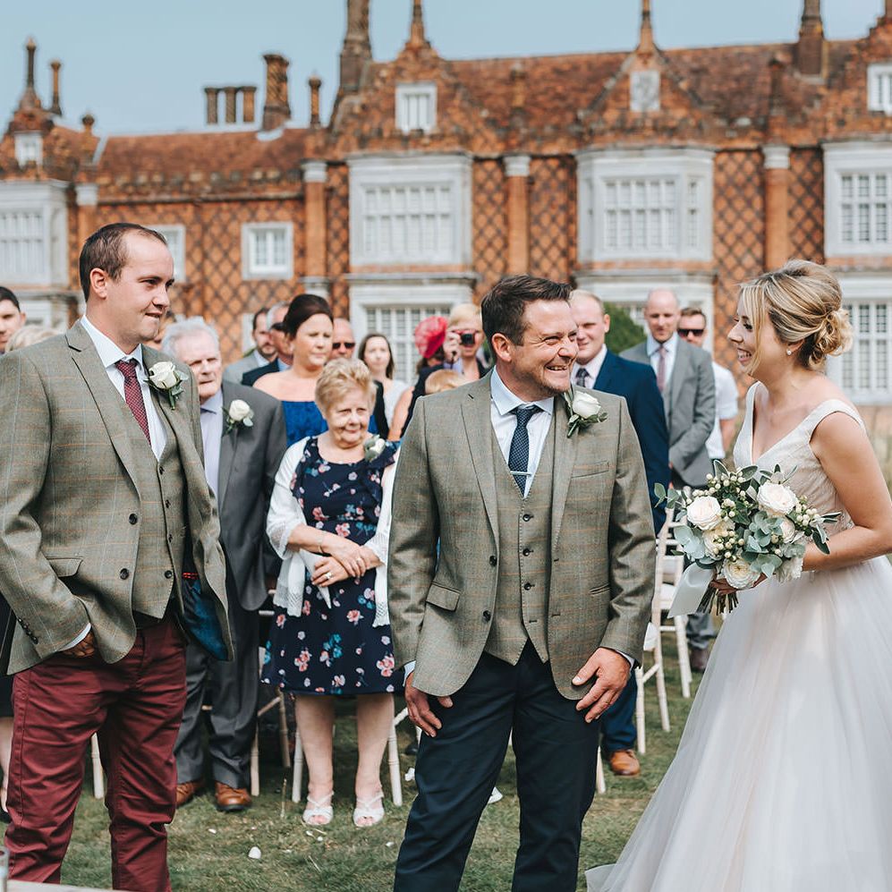Bride in Phil Collins Bridal Gown for an Outdoor Wedding Ceremony