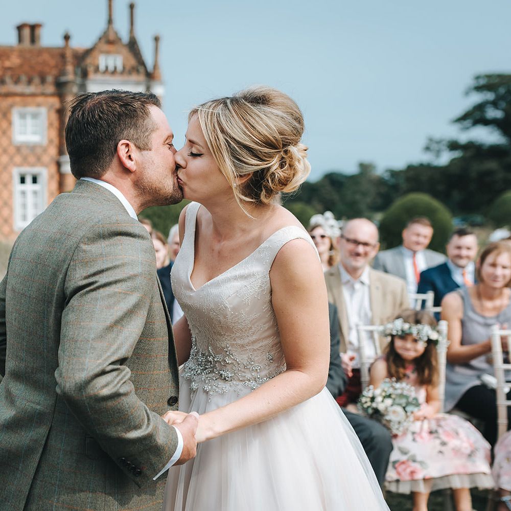 Bride in Phil Collins Bridal Gown for an Outdoor Wedding Ceremony